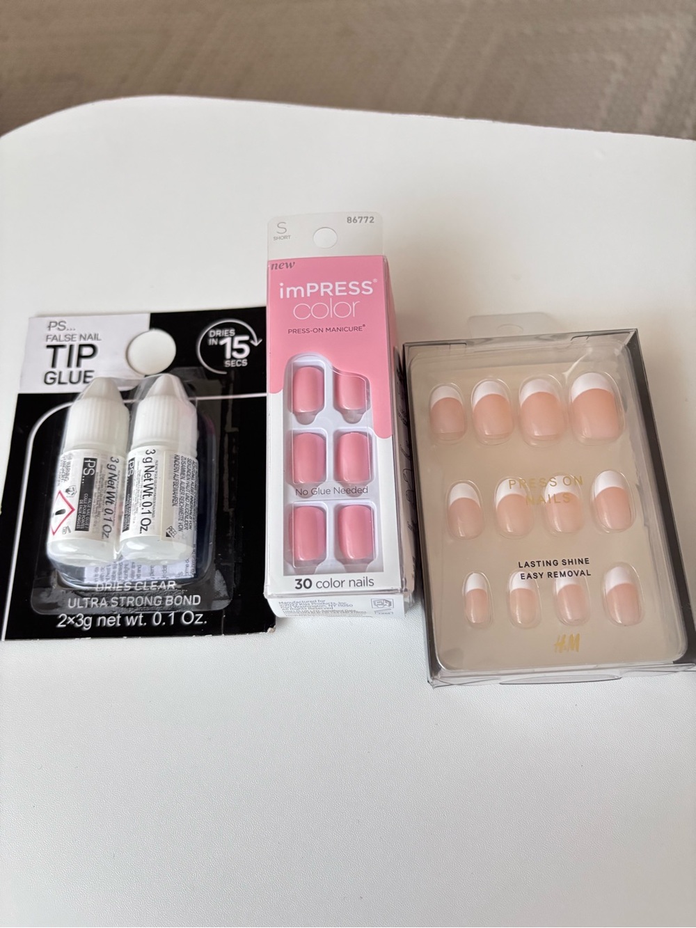 These are KISS imPRESS Color Press-On Nails and tip glue - Picture 7 of 7
